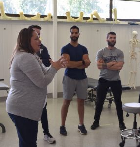 Maryclaire Cappetta instructing physical therapy students at UConn