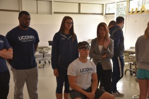 students receive physical therapy instruction in doctor of physical therapy program at UConn