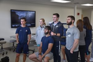 students and faculty member in kinesiology's physical therapy program